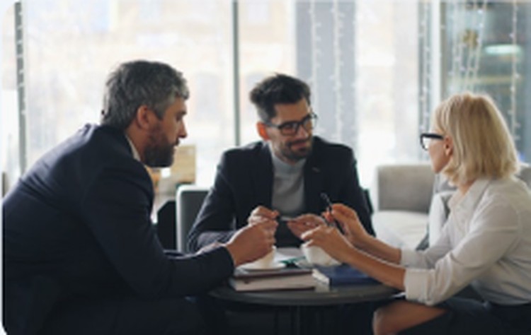 Medicare agent meeting with clients at a table