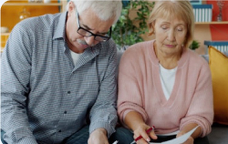 Senior couple reviewing Medicare paperwork together